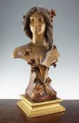 An Art Nouveau Continental painted terracotta bust of a young woman, probably Austrian, marked for