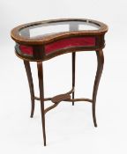An Edwardian mahogany and marquetry inlaid kidney shape bijouterie table, the top inlaid with a