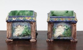 A pair of Palissy style square cache pots, 19th century, each side moulded in relief with the seated
