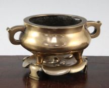 A Chinese bronze tripod censer and stand, Xuande six character mark, 19th century, the squat