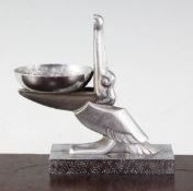 Edgar Brandt, A silvered iron ashtray or dish, modelled as a pelican, on a rectangular base,