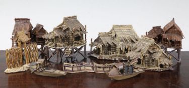 Ten Japanese stoneware models of houses, boats and bridges, early 20th century, comprising five