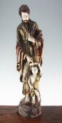 A 20th century carved and polychrome painted figure of a Saint, with attendant child, 31in.