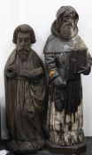 A European carved oak figure of a Saint, standing holding a book, together with another similar