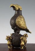 A Chinese part gilt bronze model of an eagle, in Han dynasty style, possibly late Qing dynasty,