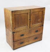 A Victorian brass bound oak military chest, with two door enclosing three sliding shelves above