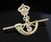 An Indian? high carat gold and gem set military related sweetheart's bar brooch, modelled as a gem