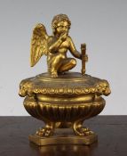 An Empire style gilt bronze inkwell and cover, first half 19th century, modelled as a classical part