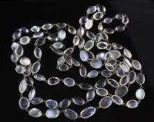 An early 20th century silver and moonstone spectacle necklace, set with oval moonstones of varying