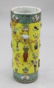 A Chinese yellow glazed and moulded porcelain 'Hundred Antiques' cylindrical stick stand, second