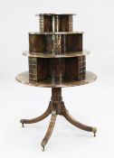 A George III mahogany revolving bookcase, circa 1820, with circular graduated three tier top, with