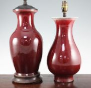 Two Chinese sang de boeuf baluster vases, 19th century, mounted as lamps, the first of pear shape,
