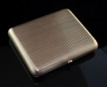 A good early 20th century Russian 56 zolotnik gold and cabochon sapphire set cigarette case by