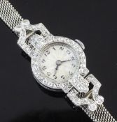 A lady's 1930's/1940's platinum and diamond cocktail watch, with Arabic dial, the bezel and lugs set