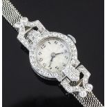 A lady's 1930's/1940's platinum and diamond cocktail watch, with Arabic dial, the bezel and lugs set