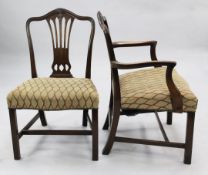 A set of eight George III Hepplewhite style mahogany dining chairs, including two carvers, with