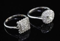 Two 1920's/1930's diamond cluster rings, circular form set in platinum and tablet form in a white