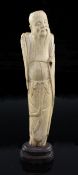 A Chinese ivory figure of an immortal, late Ming dynasty, the old bearded man wearing flowing