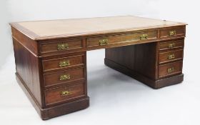 A Victorian mahogany partner's desk, with Greek key tooled brown leather writing skiver, above an