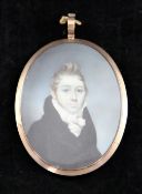 Early 19th century English Schooloil on ivory,Miniature portrait of a gentleman in a black coat,