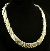 A stylish late 1980's Kutchinsky 18ct gold interwoven double link necklace, with triangular