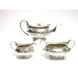 A MATCHED THREE PIECE GEORGIAN SILVER TEA SERVICE teapot marked for Joseph Angell, London 1821,