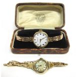 THOMAS RUSSELL & SON, LADY'S 9CT GOLD WRISTWATCH on an expanding baton link bracelet, cased; with