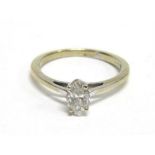 A SINGLE STONE MARQUISE DIAMOND RING stamped '750' to the white mount, the diamond of