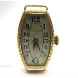 ROLEX, A LADY'S 18CT GOLD WRISTWATCH the bowed rectangular shaped signed silver dial with black