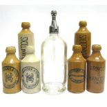 SIX HANCOCK'S OF WIVELISCOMBE STONEWARE GINGER BEER BOTTLES all different, including one Arnold &