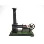 A BING TINPLATE STATIONARY HOT AIR ENGINE circa 1925, with two cylinders, a flywheel, and a