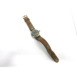 A SECOND WORLD WAR BRITISH SERVICE ISSUE WRISTWATCH the circular black face with white Arabic