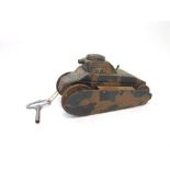 A TINPLATE TANK unmarked, with a camouflage finish, fitted with a clockwork mechanism, 20cm long (