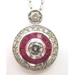 A DIAMOND AND CALIBRE RUBY 18CT WHITE GOLD PENDANT on chain, the central diamond of approximately