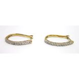 A PAIR OF 9CT GOLD DIAMOND HOOP EARRINGS set with thirteen single cuts to each earring, 2g gross