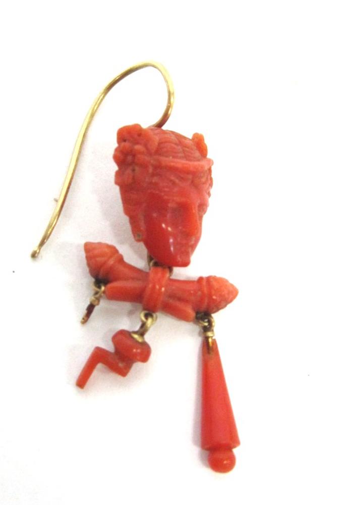 A SINGLE VICTORIAN CARVED CORAL DROP EARRING the carved mask with pendants below, some deficient