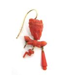 A SINGLE VICTORIAN CARVED CORAL DROP EARRING the carved mask with pendants below, some deficient