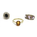 A SAPPHIRE AND CUBIC ZIRCONIA 9CT GOLD CLUSTER RING with an amethyst dress ring; and a single