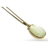 A 9 CARAT GOLD MOTHER OF PEARL PENDANT one side white the other of pinkish hue, 4.2cm long including