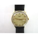 LONGINES, A GENTLEMANS 9 CARAT GOLD WRISTWATCH Birmingham 1957, the signed circular dial with gilt