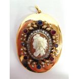 AN UNUSUAL CAMEO & GEM SET LARGE OVAL LOCKET the shell carved as a classical female in profile