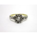 A VICTORIAN DIAMOND CLUSTER RING the central collet set old cut brilliant of approximately 0.2