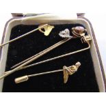 A COLLECTION OF FIVE VARIOUS STICKPINS