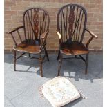 A MATCHED PAIR OF ASH ELM AND BEECH WHEELBACK ARMCHAIRS the larger 107cm high, the elm seat 47cm