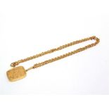 A 9CT GOLD CHAIN  of heavy trace links, 68cm long, 22g gross; with a locket