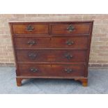 AN 18TH CENTURY OAK AND MAHOGANY CROSSBANDED CHEST OF TWO SHORT AND THREE LONG DRAWERS flanked by