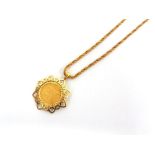 AN 1892 SHIELD BACK HALF SOVEREIGN  in a 9ct gold pendant mount, on a 9ct gold fancy link 40cm