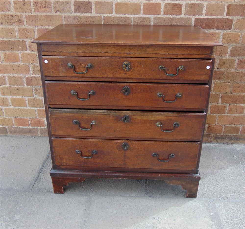 A SMALL OAK CHEST fitted with four long graduated drawers, 76.5cm wide 47cm deep 80.5cm high