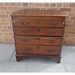 A SMALL OAK CHEST fitted with four long graduated drawers, 76.5cm wide 47cm deep 80.5cm high