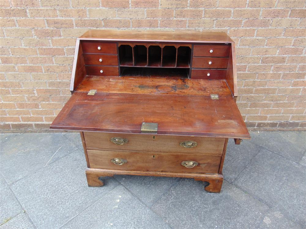 A GEORGE III MAHOGANY BUREAU with fitted interior, four graduated drawers on bracket feet, 102cm - Image 2 of 3